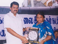 Mrs.Rani Krishnan being awarded for her social service by MP,President of Tamil Maanila Congress Thiru G.K.Vaasan.